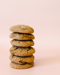 Crumble Charms chocolate chip gluten-free vegan cookies on pink background